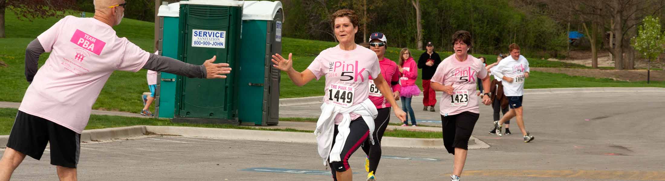 PBA employees encourage their coworkers as they run the Pink 5k